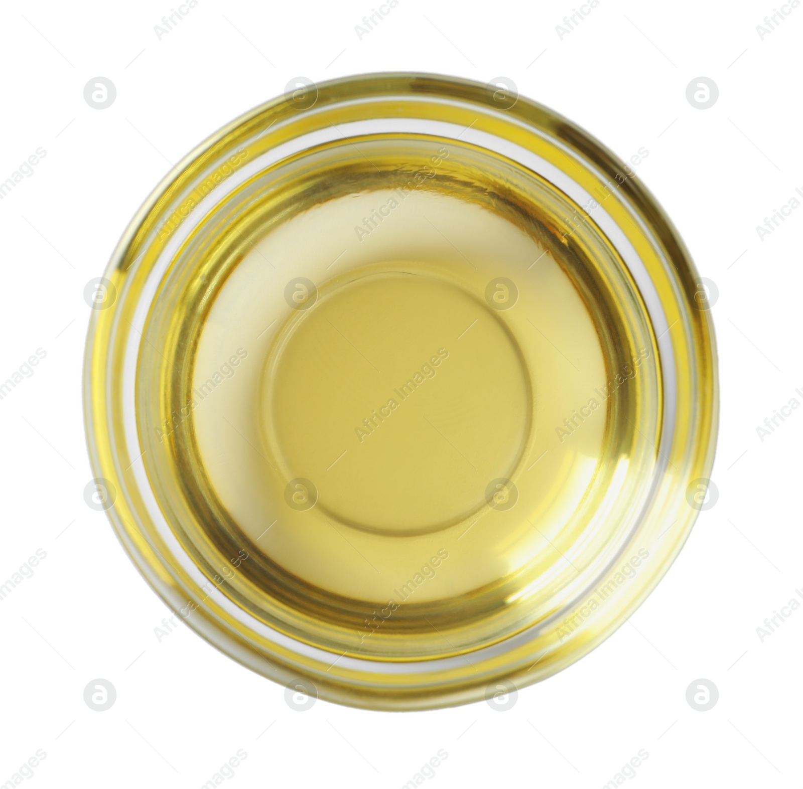Photo of Glass bowl of cooking oil isolated on white, top view