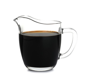 Photo of Glass jug with balsamic vinegar on white background