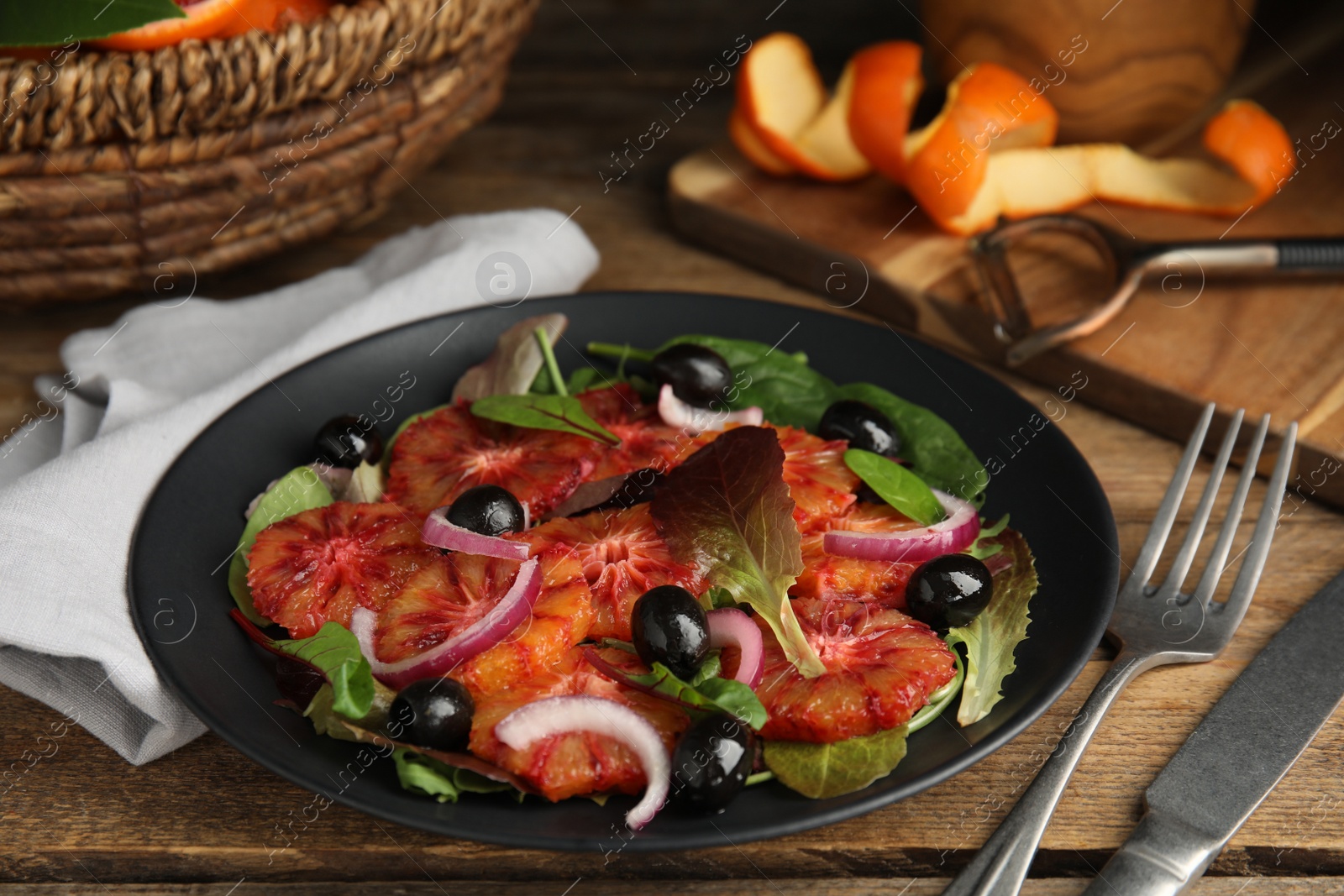 Photo of Platedelicious sicilian orange salad on wooden table