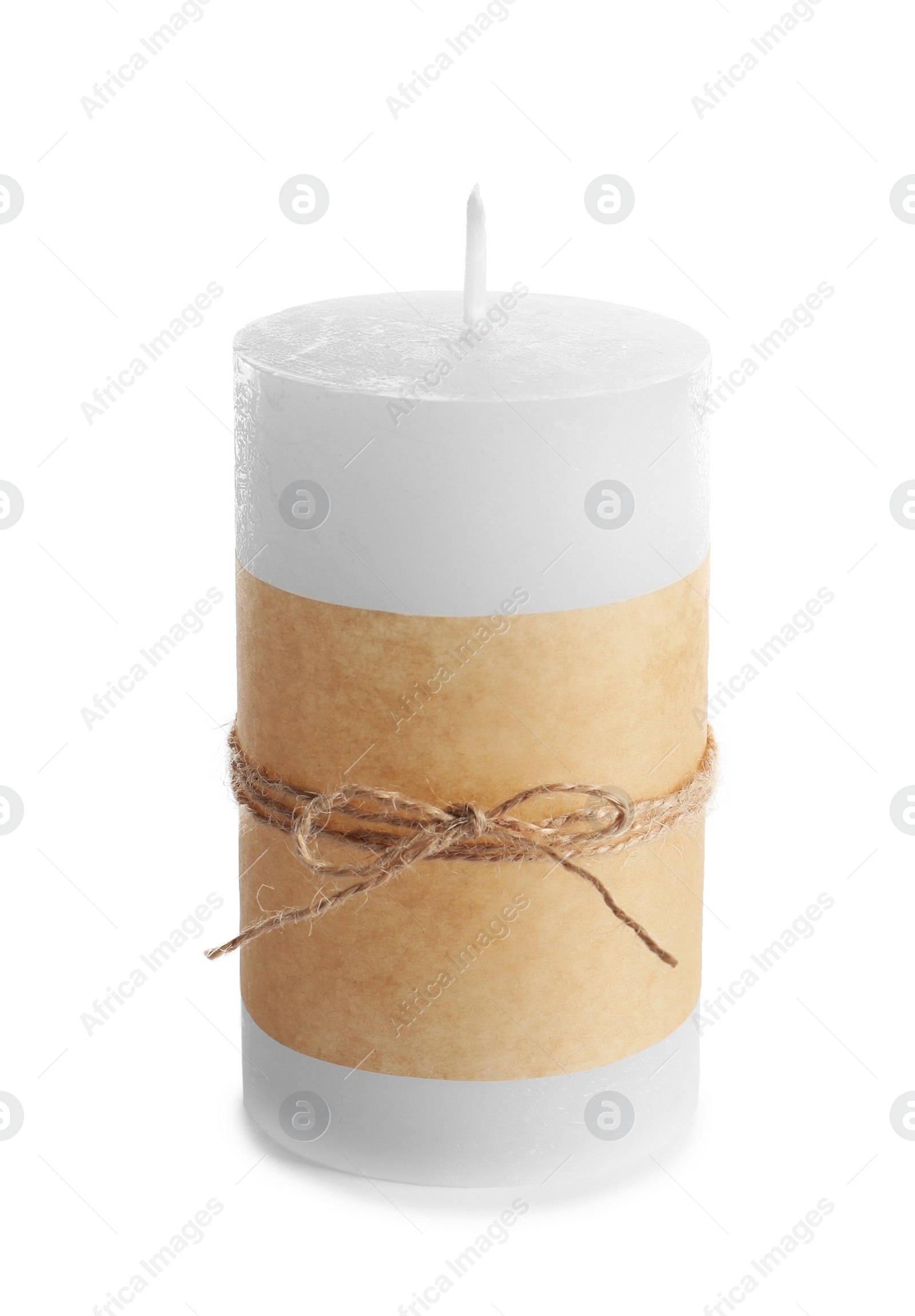 Photo of New wax candle decorated with parchment on white background