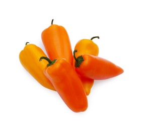 Photo of Fresh raw orange hot chili peppers isolated on white, top view