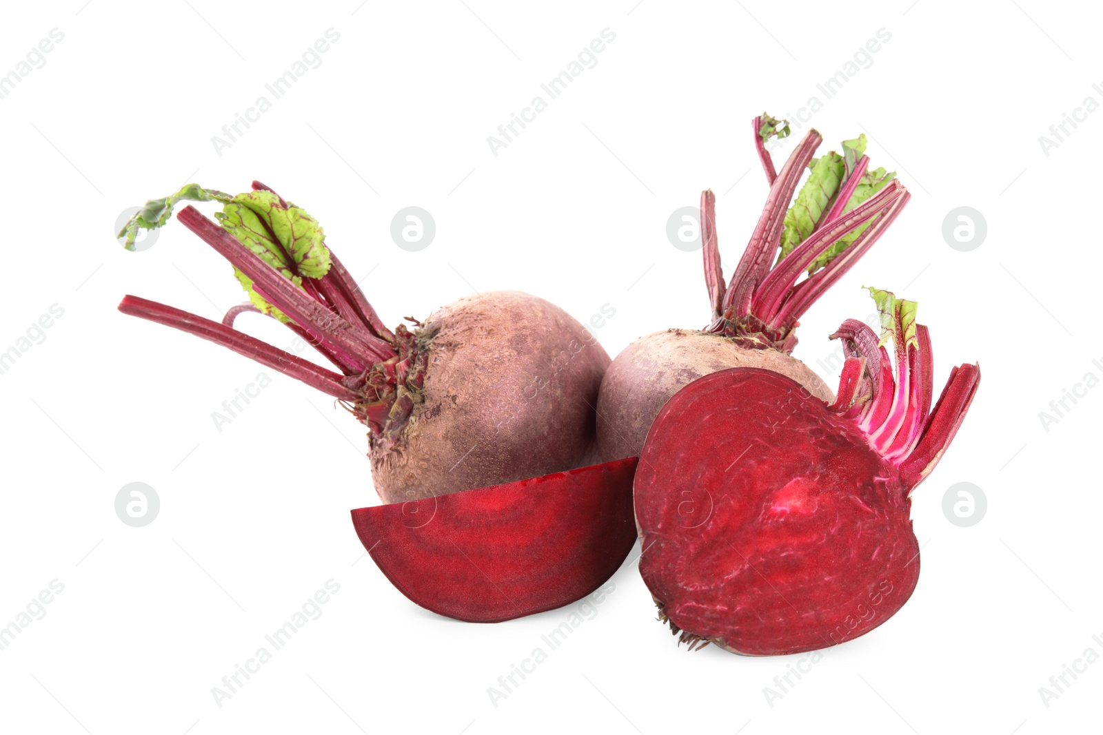 Photo of Whole and cut ripe beetroots on white background