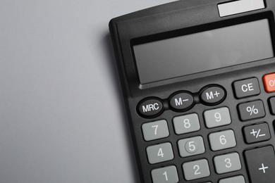 Photo of Calculator on gray background, top view. Space for text