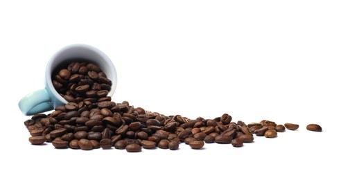 Overturned cup and roasted coffee beans on white background
