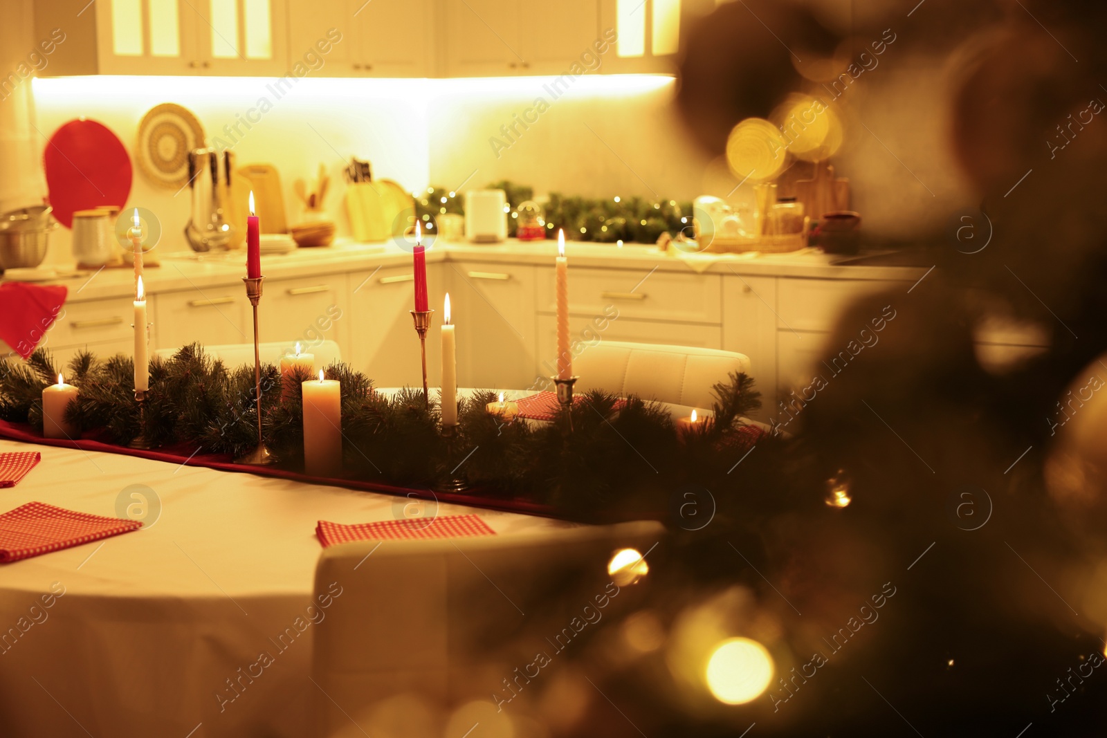 Photo of Cozy spacious kitchen decorated for Christmas. Interior design