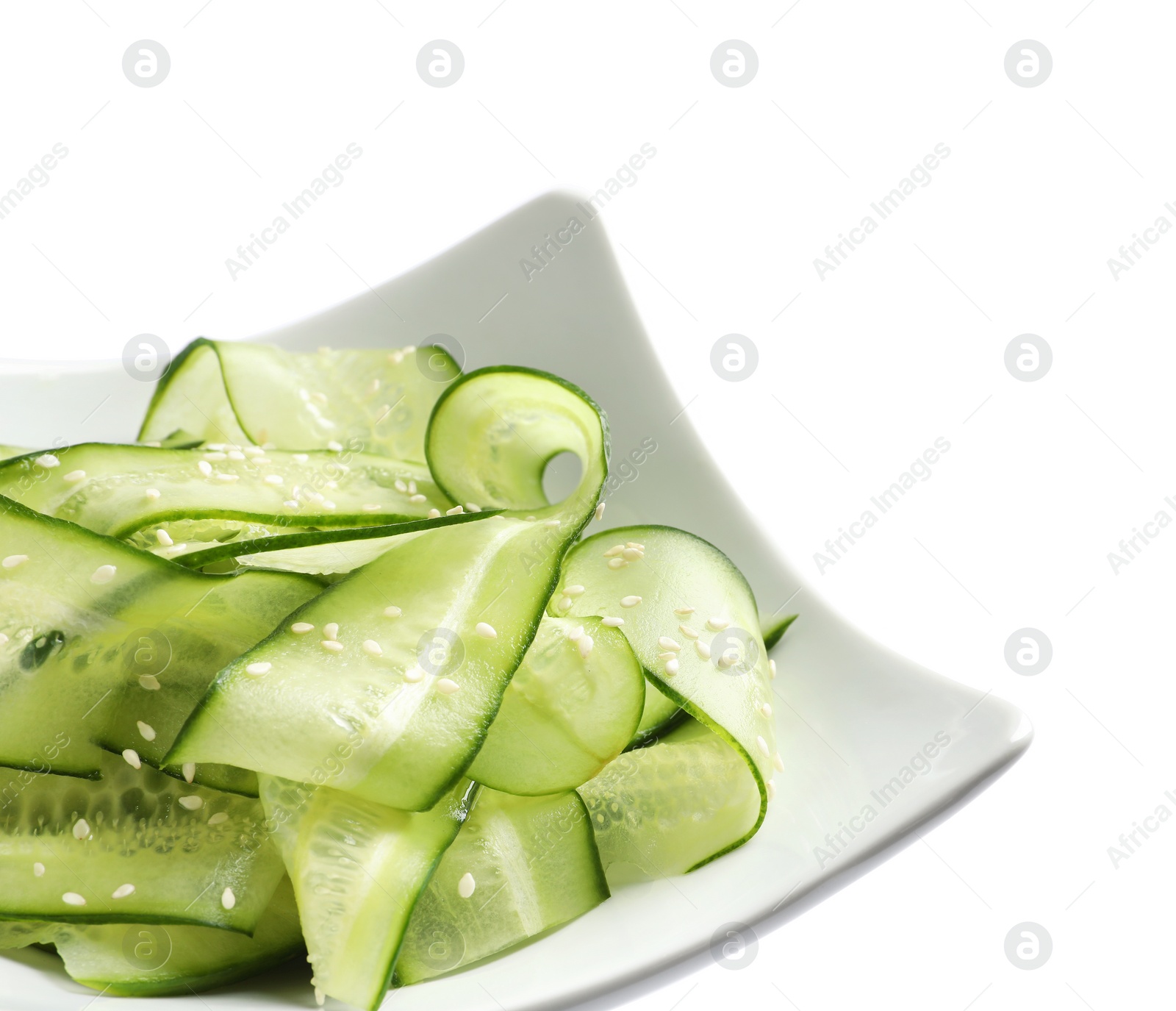 Photo of Plate with delicious cucumber salad on white background, closeup