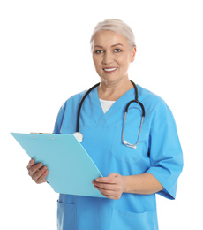 Photo of Mature doctor with clipboard on white background