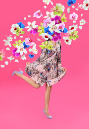 Image of Creative spring fashion composition. Dancing girl and flowers splash