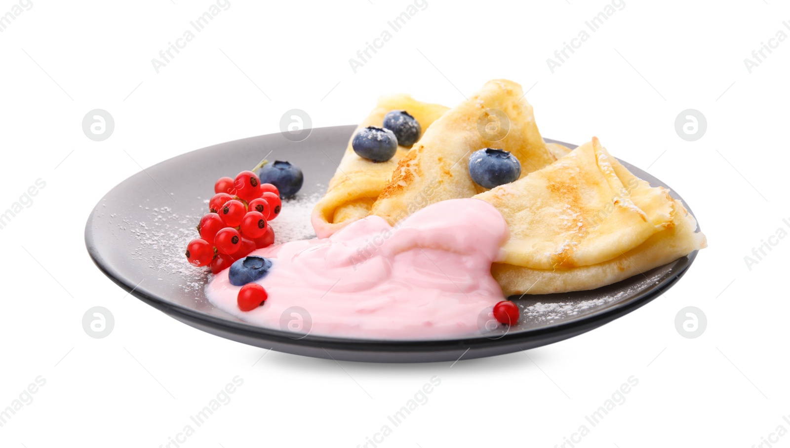 Photo of Delicious crepes with natural yogurt, blueberries and red currants on white background