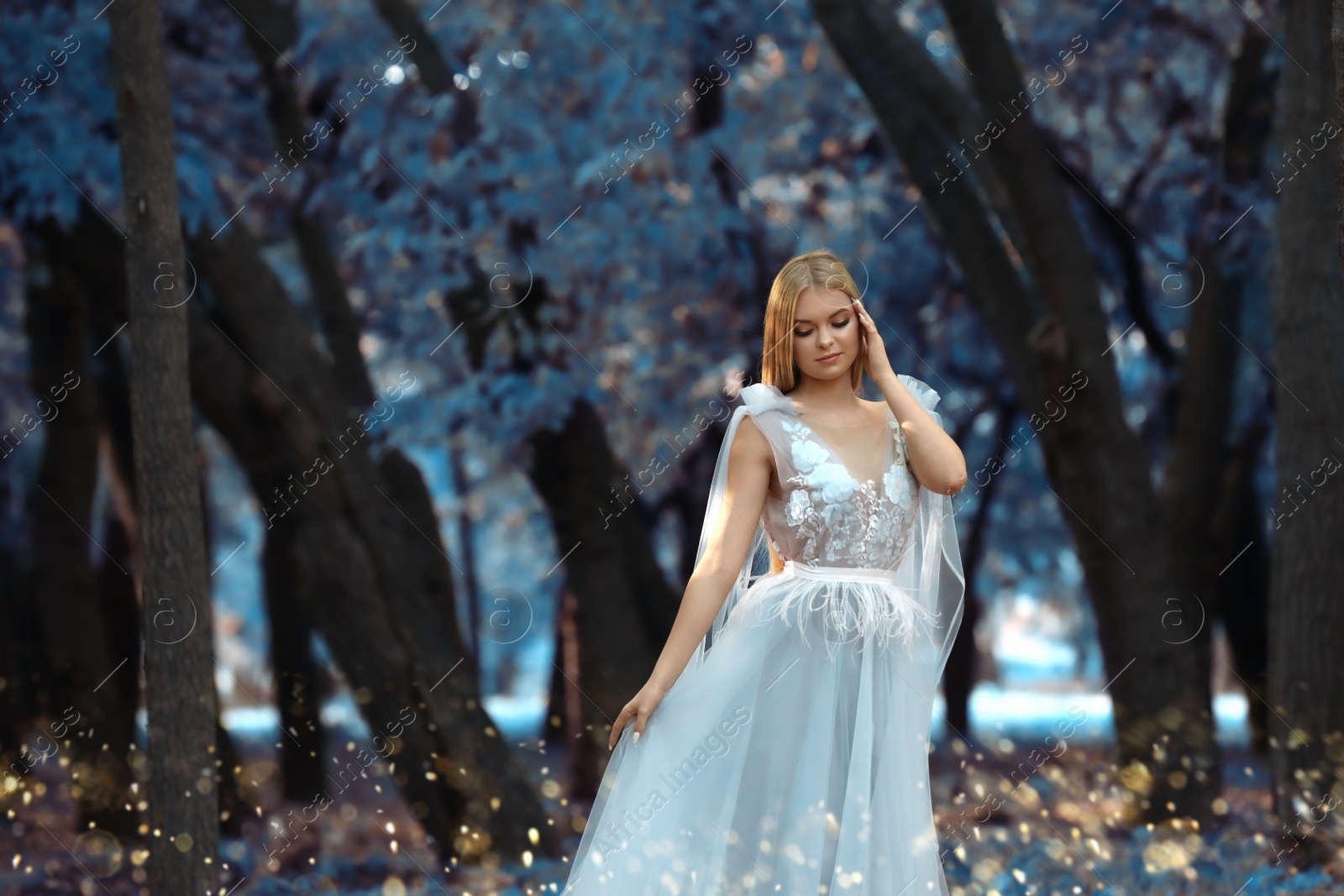 Photo of Beautiful girl wearing fairy dress in autumn forest