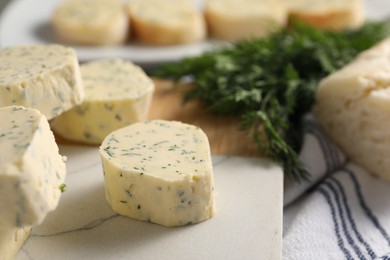 Photo of Tasty butter with dill on table, closeup