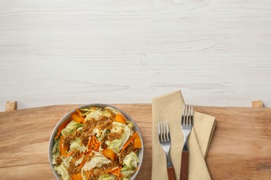 Photo of Delicious salad with Chinese cabbage and mustard seed dressing on white wooden table, top view. Space for text