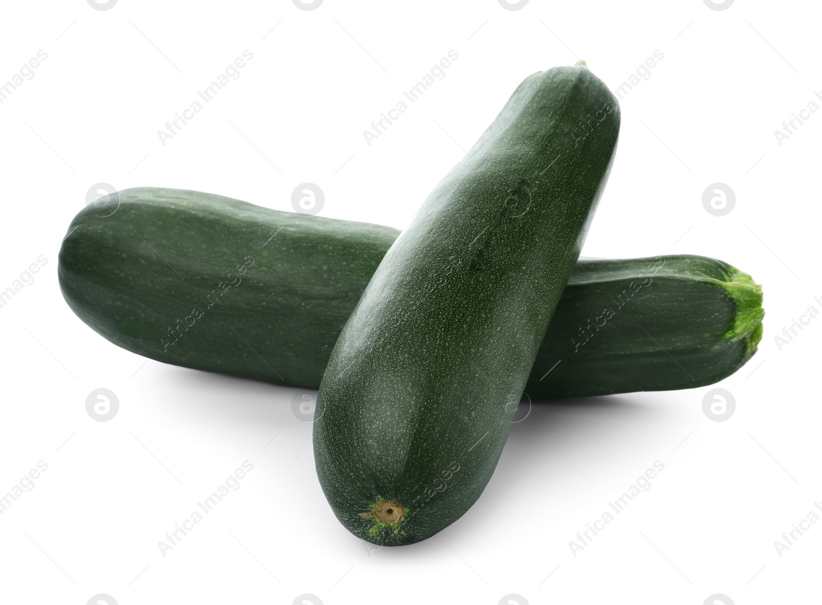 Photo of Fresh ripe green zucchinis on white background