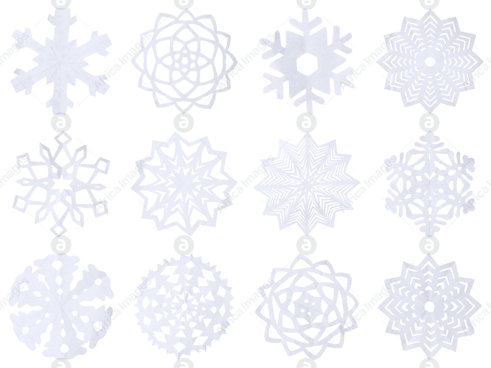 Image of Set of beautiful paper snowflakes on white background