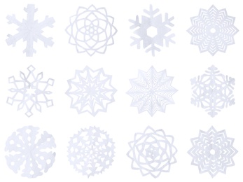 Image of Set of beautiful paper snowflakes on white background