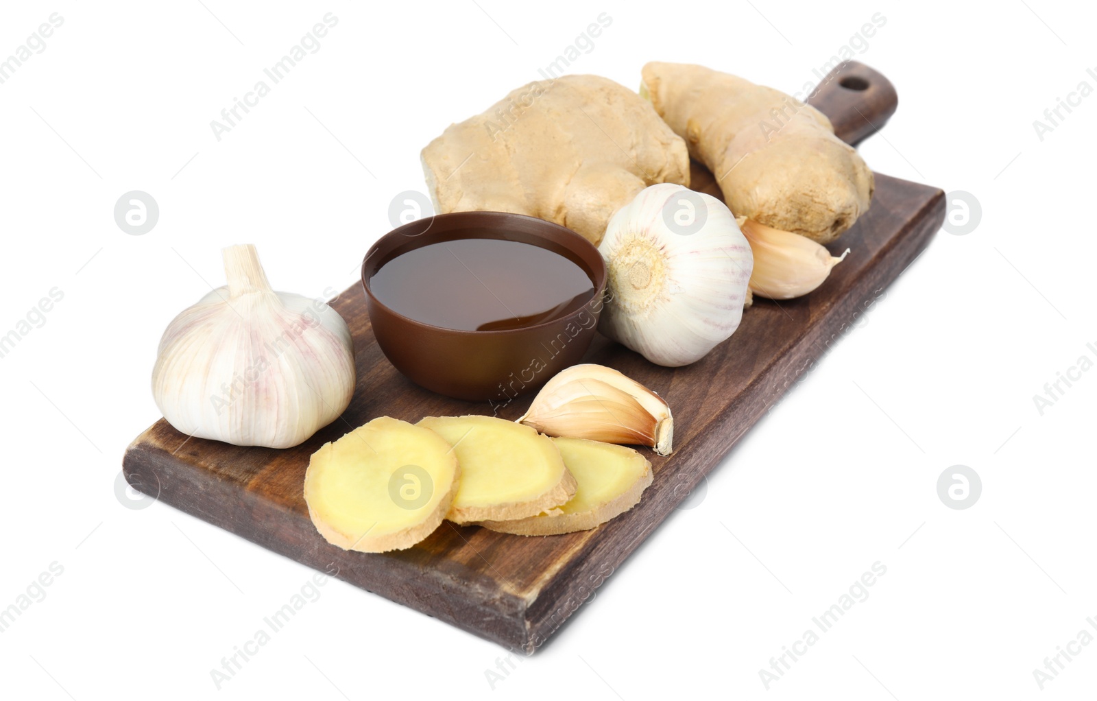 Photo of Fresh garlic and other natural cold remedies isolated on white