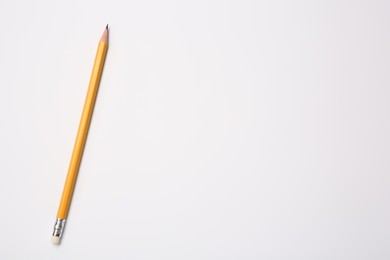 Photo of Sharp graphite pencil on white background, top view. Space for text