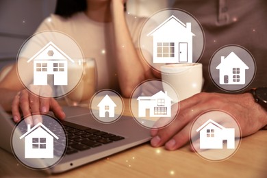 House search. Couple choosing home via laptop at table, closeup. Illustrations of different buildings as real estate variations