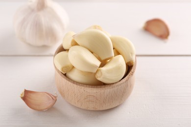 Fresh garlic on white wooden table, closeup