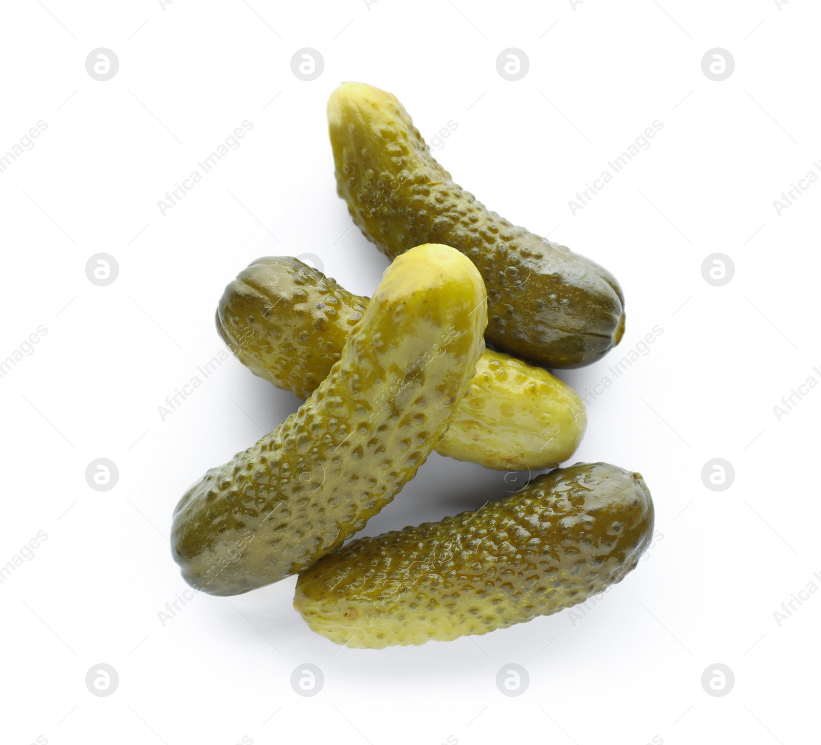 Photo of Pile of tasty pickled cucumbers on white background, top view