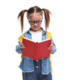 Photo of Cute little girl with backpack reading book on white background