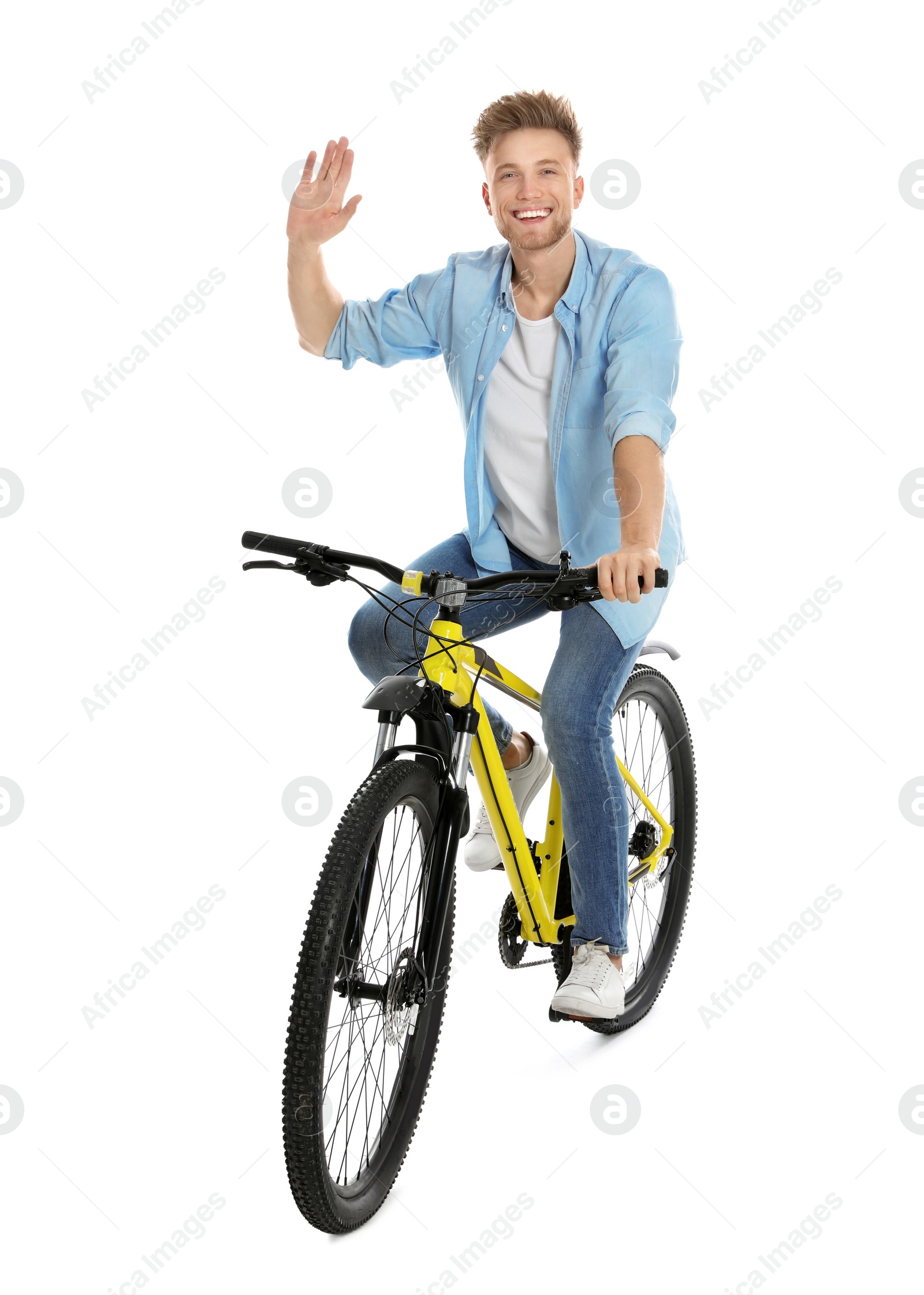 Photo of Handsome young man riding bicycle on white background