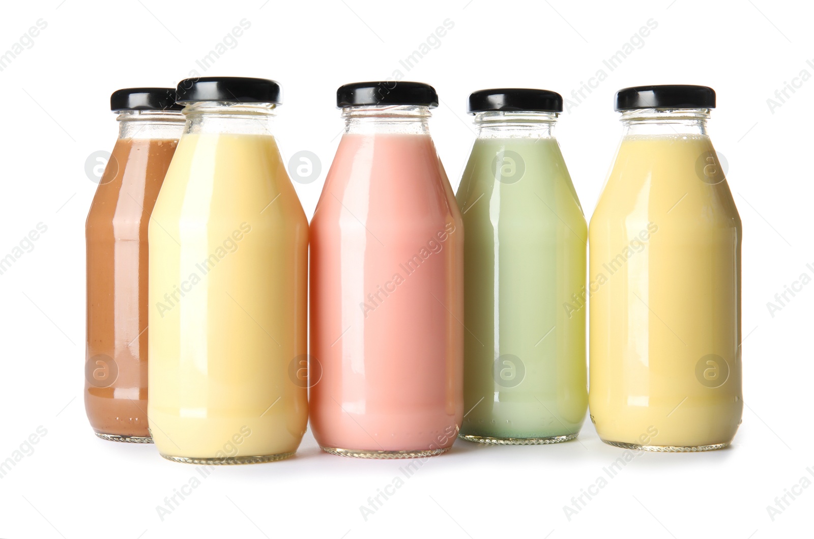 Photo of Bottles with different smoothies on white background