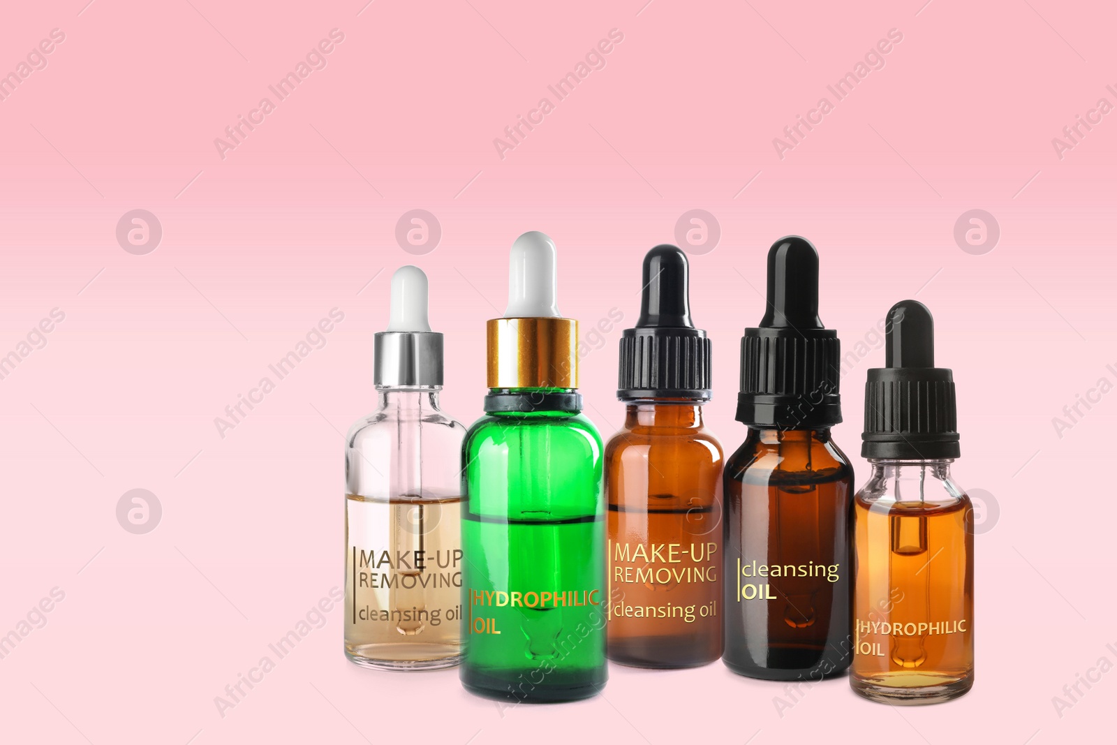 Image of Collection of different makeup removal products on pink background