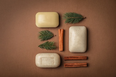 Photo of Flat lay composition with different soap bars on color background