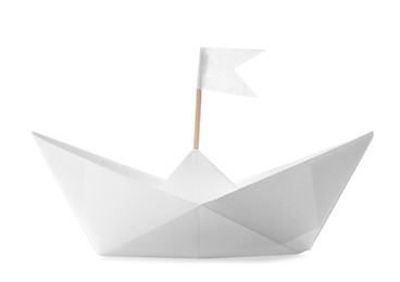 Photo of Handmade paper boat with flag isolated on white. Origami art