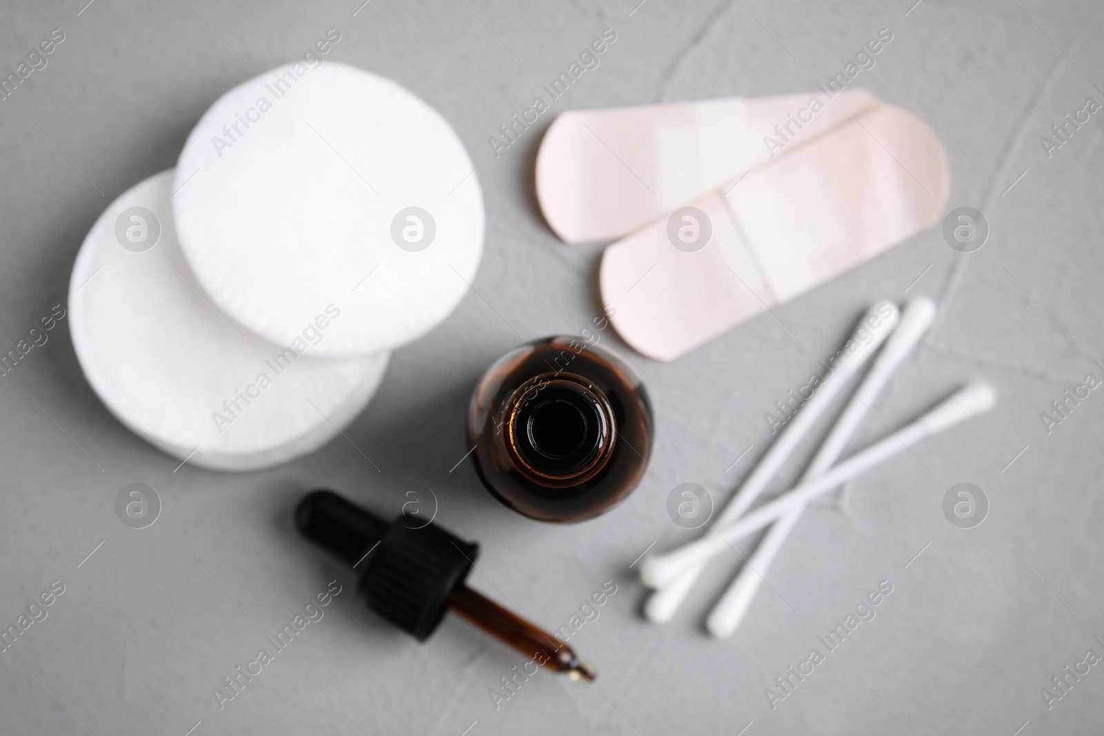 Photo of Flat lay composition with bottle of medical iodine on grey table