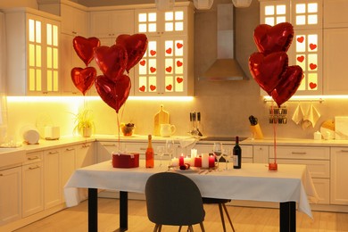 Romantic atmosphere. Cosy kitchen with set table decorated for Valentine day