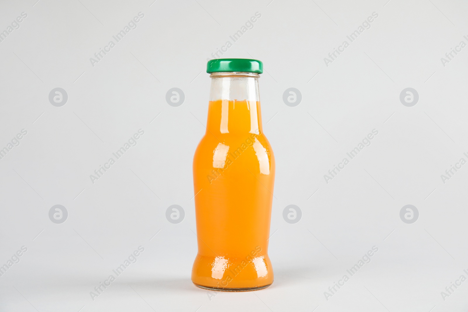 Photo of One bottle with tasty drink on color background