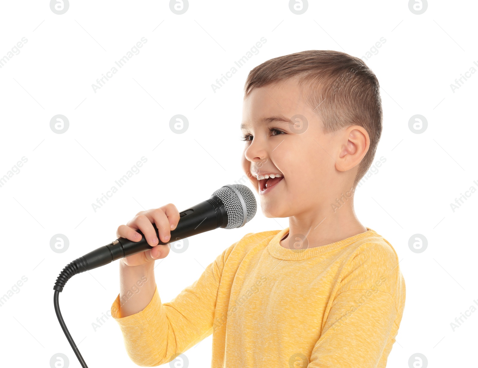 Photo of Cute funny boy with microphone on white background