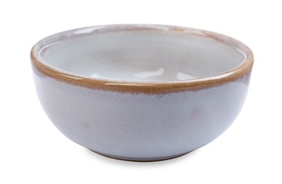 Photo of One new ceramic bowl on white background