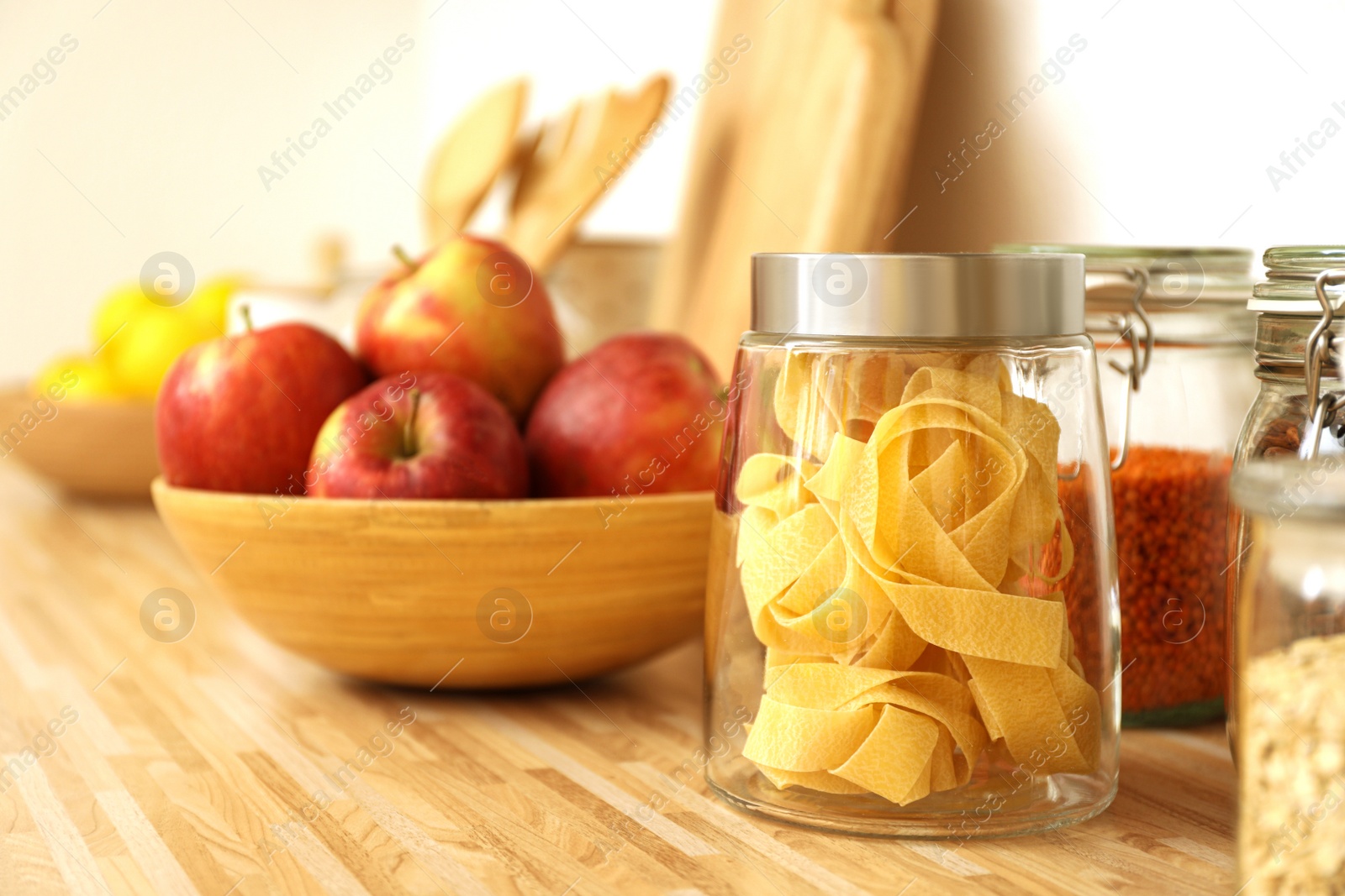 Photo of Different products on wooden countertop in kitchen