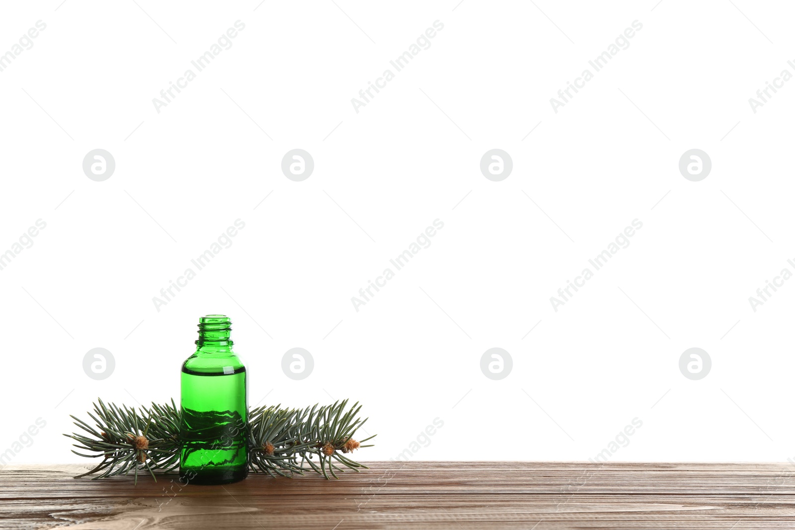 Photo of Composition with bottle of conifer essential oil on table against white background. Space for text