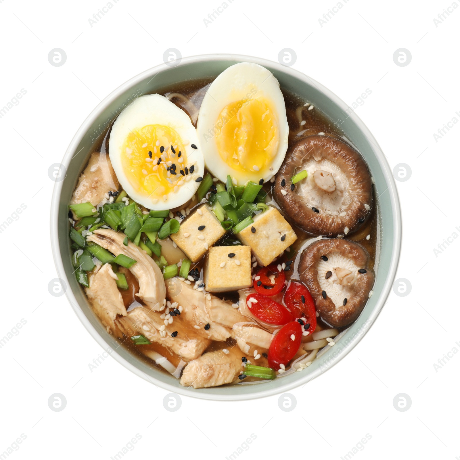 Photo of Bowl of delicious ramen isolated on white, top view. Noodle soup