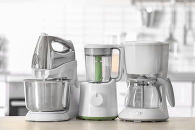 Photo of Kitchen appliances on table against blurred background