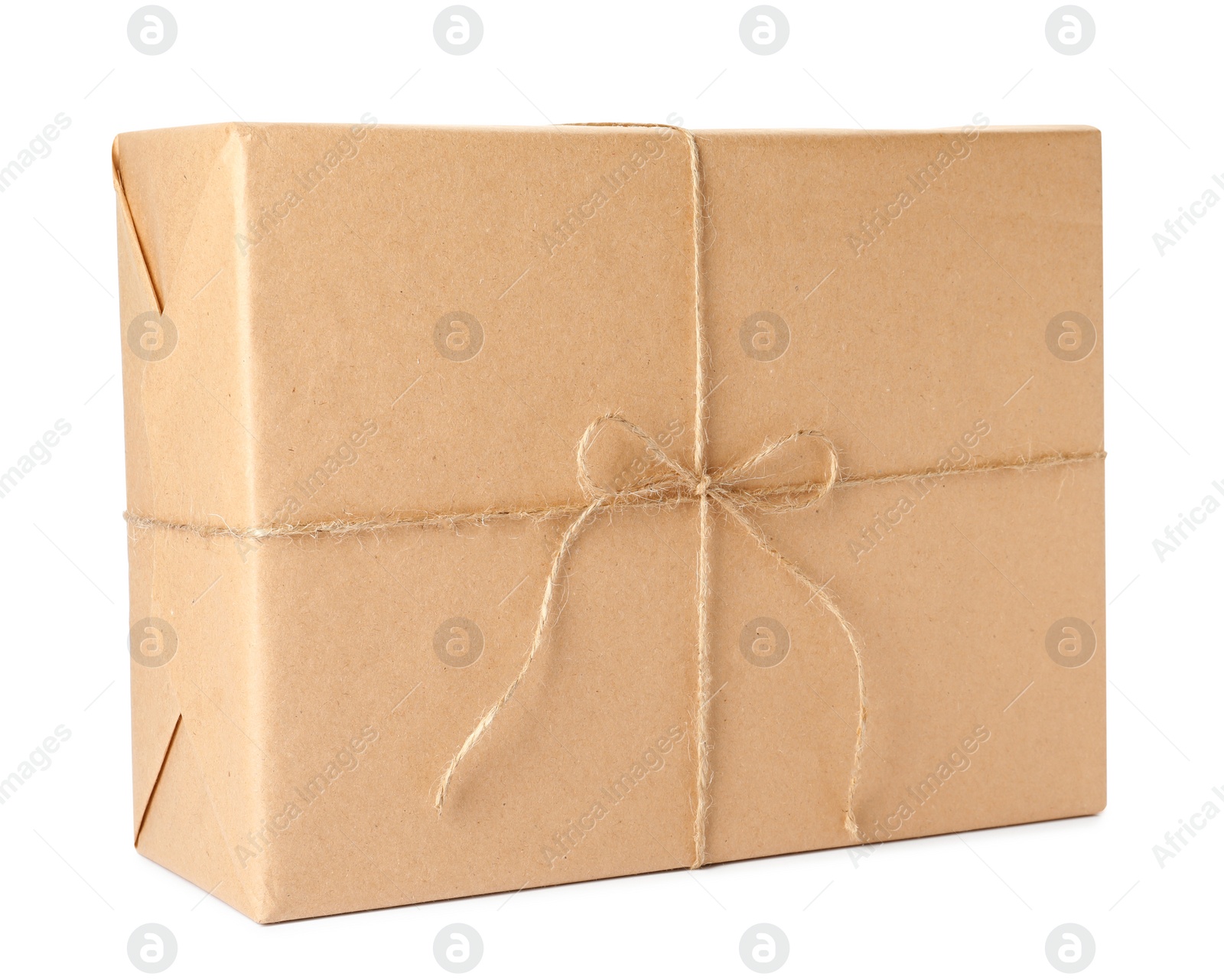 Photo of Parcel wrapped with kraft paper and twine isolated on white