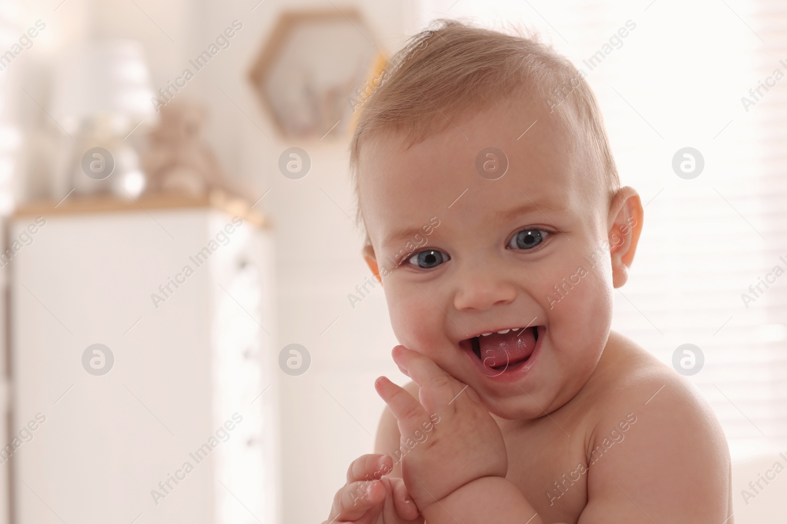 Photo of Portrait of cute little baby at home. Space for text