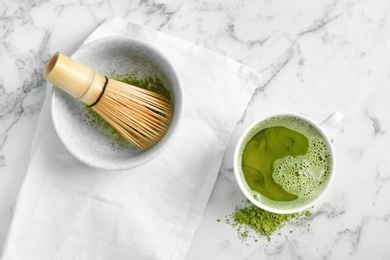 Flat lay composition with matcha tea on marble background