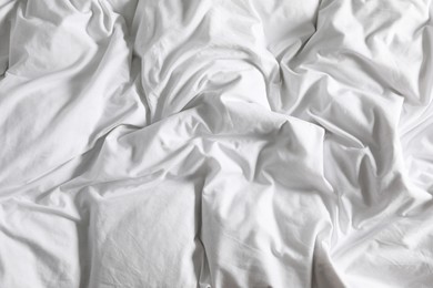 Photo of Crumpled white fabric as background, closeup view