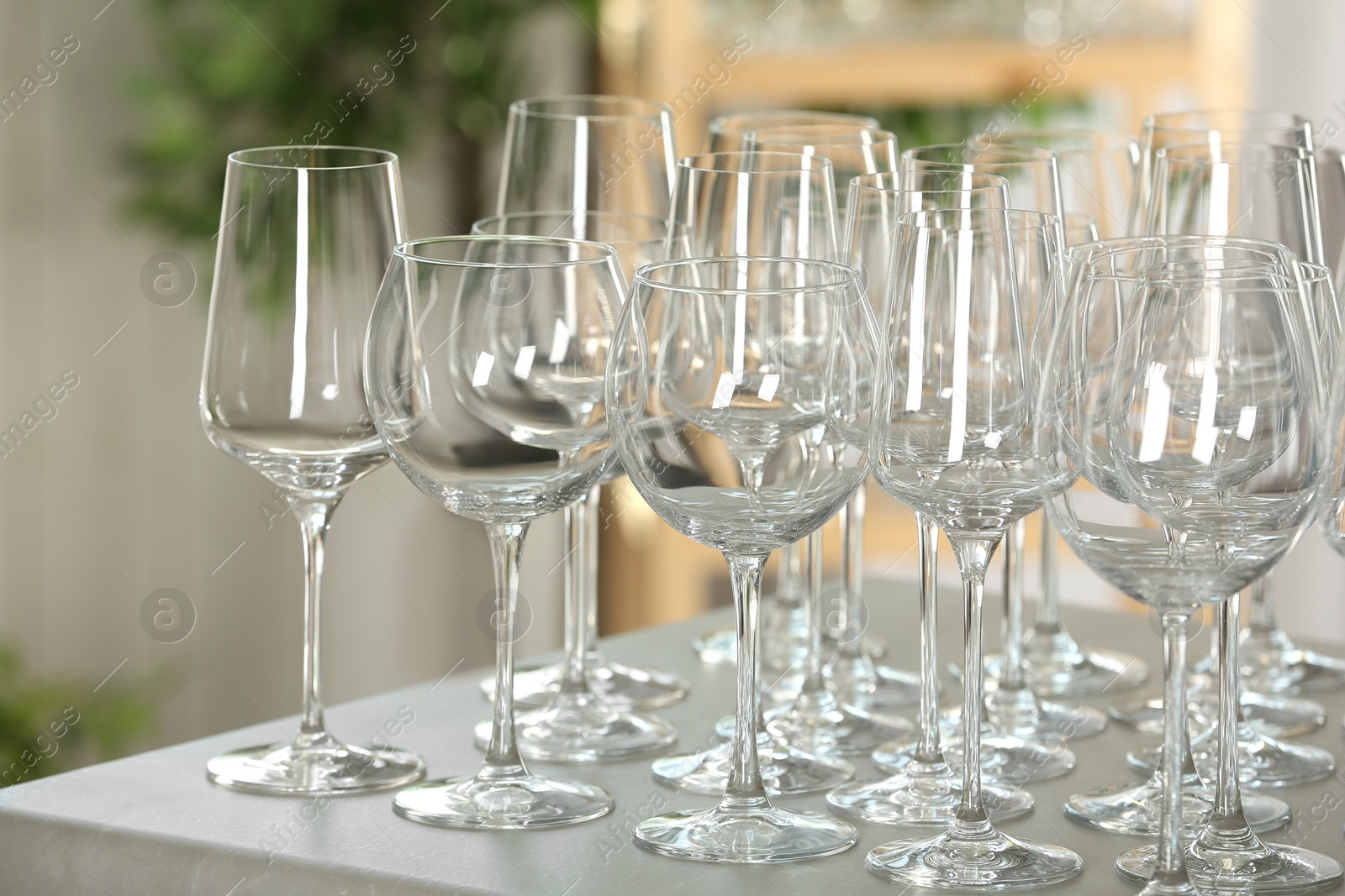 Photo of Set of empty glasses on grey table