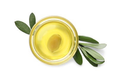 Photo of Olive oil in bowl and leaves on white background, top view. Healthy cooking
