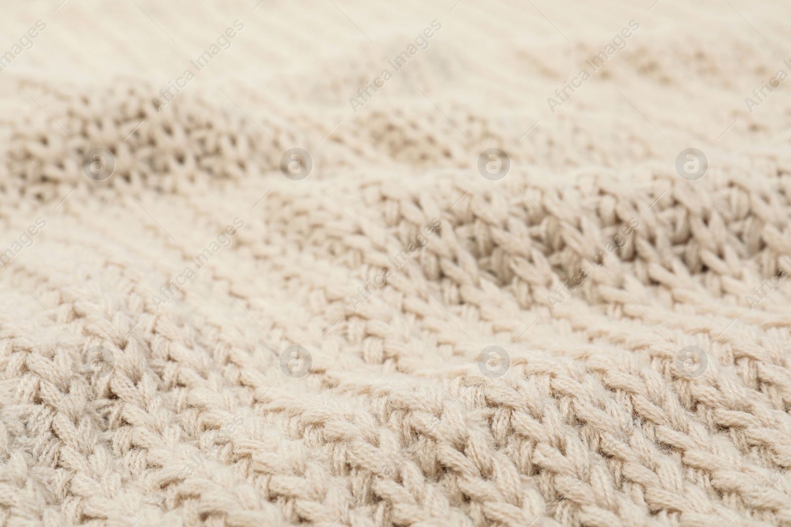 Photo of Texture of cozy warm sweater as background, closeup