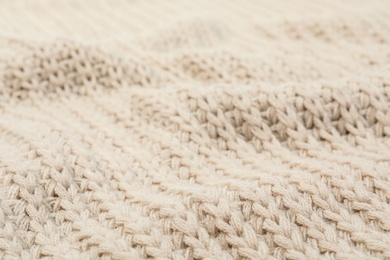 Texture of cozy warm sweater as background, closeup