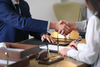 Photo of Male lawyer working with clients in office, closeup