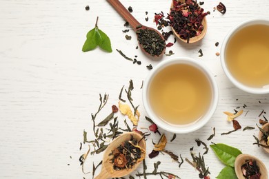 Photo of Flat lay composition with green tea on white wooden table