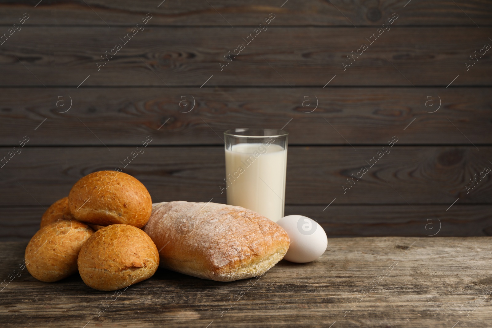 Photo of Allergenic food. Different fresh products on wooden table, space for text